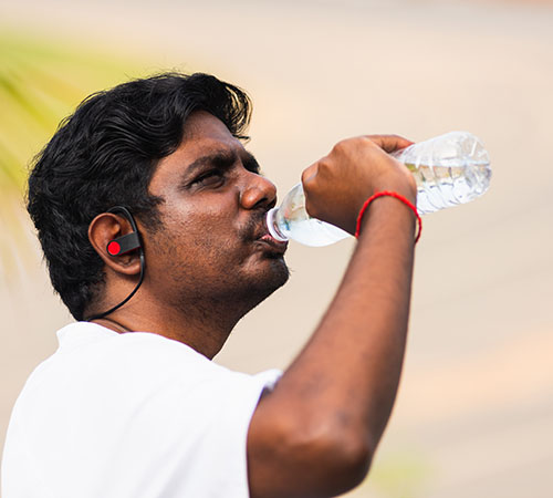 Young man drinking water